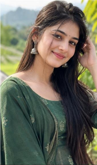Natural looking young woman smiling in soft daylight